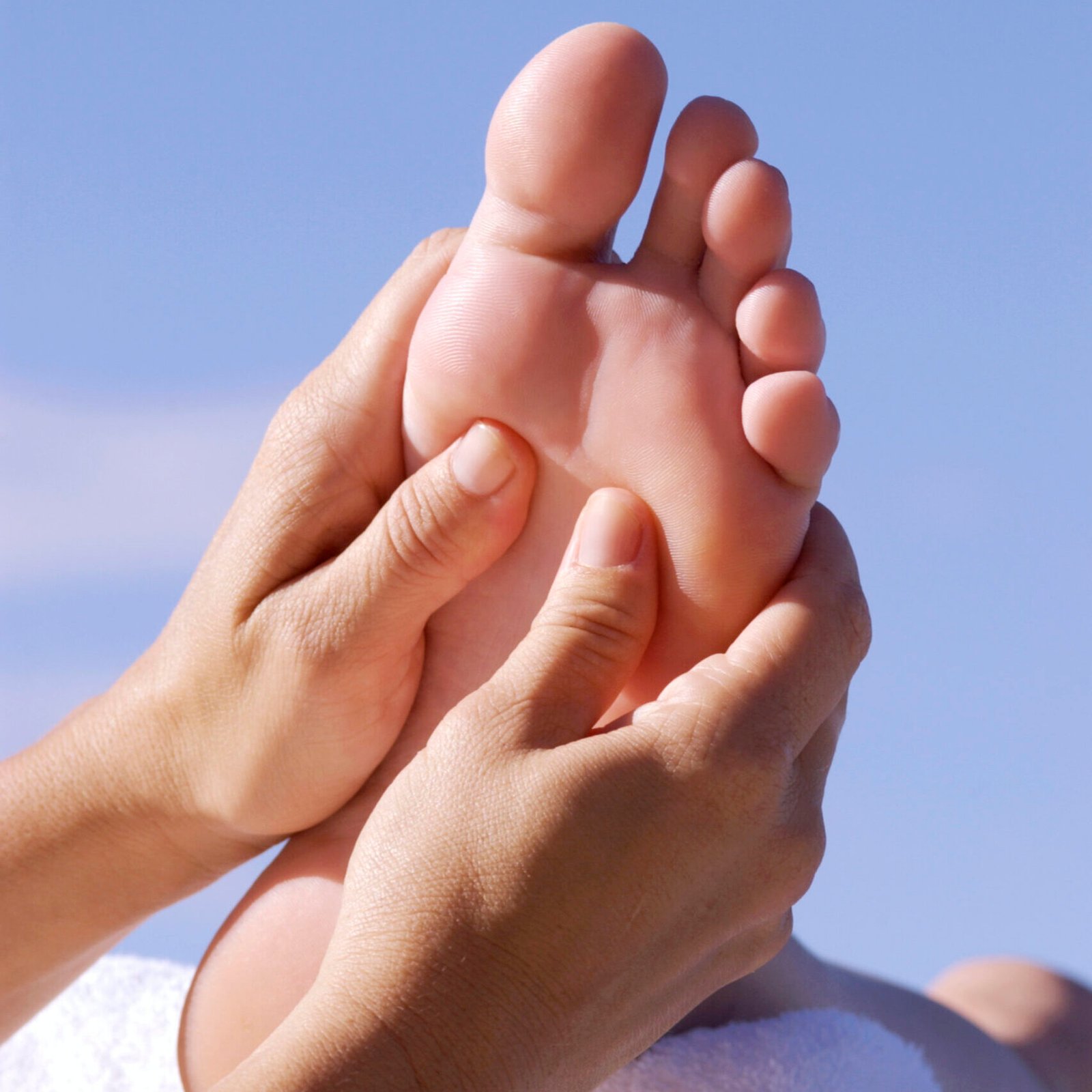 Image of bare foot being massaged