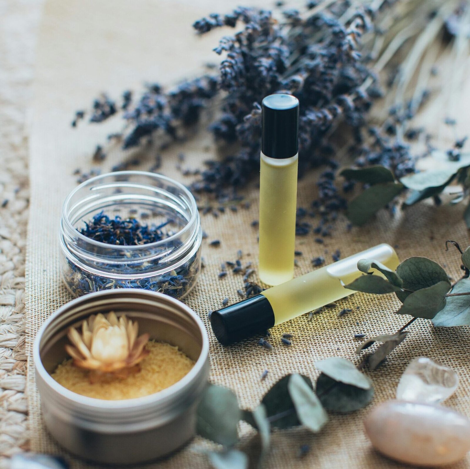 Image of lavender, massage oils and stones